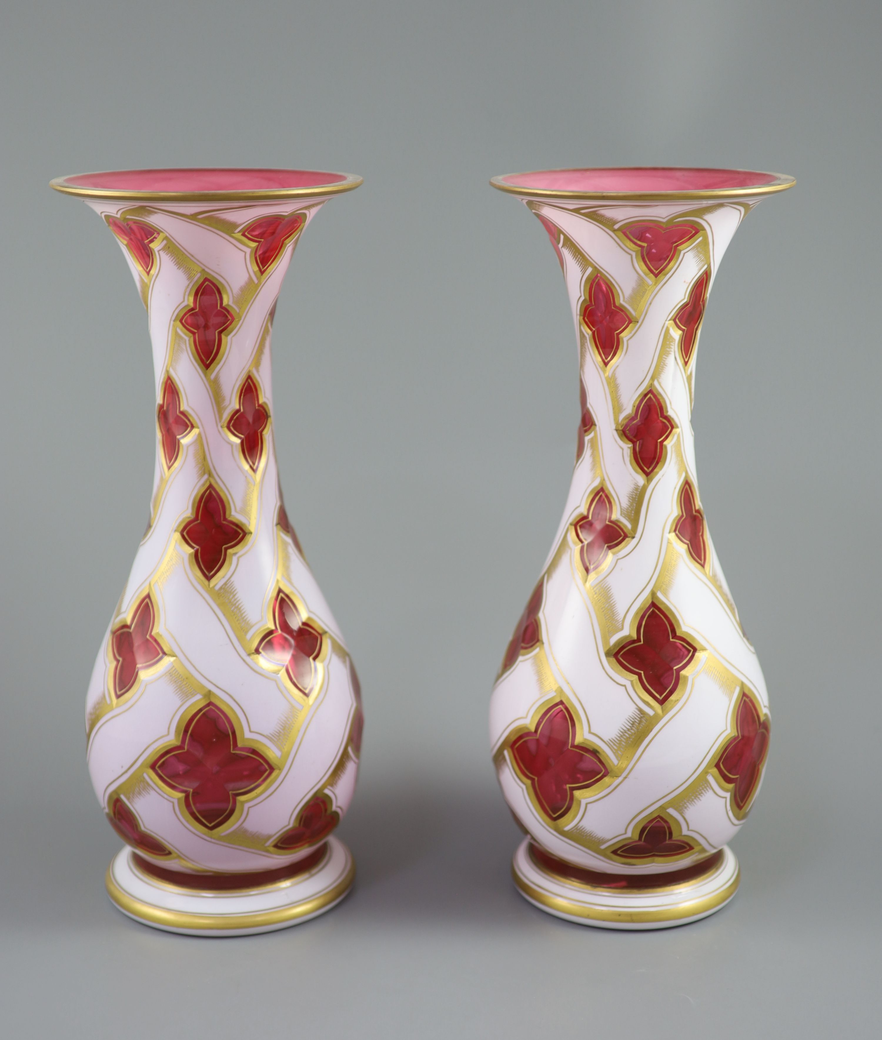A pair of Bohemian white and ruby overlaid glass baluster vases, late 19th century, 34cm high
